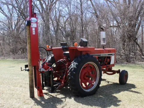 Shaver hydraulic post driver on a tractor